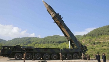 Koreyanın raketi 330 sərnişini olan təyyarənin yanından keçib