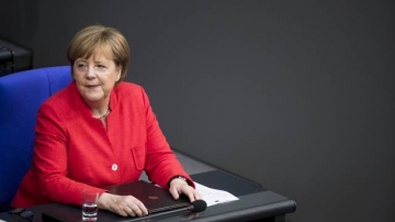 Merkel: “Biz artıq ticarət müharibəsinin cizgilərini görürük”